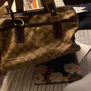 Large spacious handbag with studs and buckles.